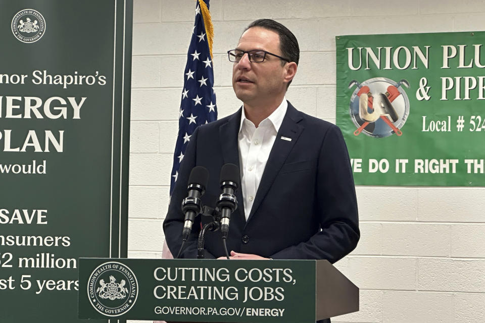 Pennsylvania Gov. Josh Shapiro speaks at a news conference at the United Association Local 524 union building in Scranton, Pa., on Wednesday, March 13, 2024. Shapiro announced he would back legislation to make power plant owners in Pennsylvania pay for their planet-warming greenhouse gas emissions and require utilities in the nation's third-biggest power-producer to buy more electricity from renewable sources. (AP Photo/Michael Rubinkam)