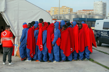 FILE PHOTO: Migrants intercepted in the Mediterranean after disembarking from a rescue boat at the port of Malaga, southern Spain, November 13, 2018. REUTERS/Jon Nazca/File Photo