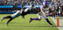 Minnesota Vikings receiver K.J. Osborn (17) catches a 27-yard touchdown reception as Carolina Panthers safety Sean Chandler (34) defends in overtime of an NFL football game, Sunday, Oct. 17, 2021, in Charlotte, N.C. (Carlos Gonzalez/Star Tribune via AP)