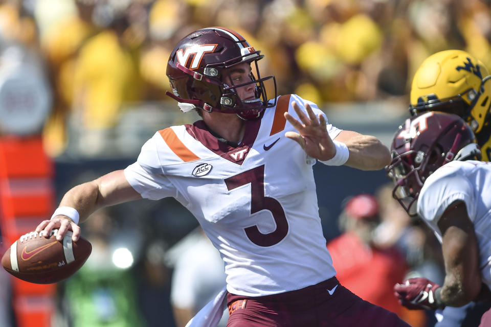 Virginia Tech quarterback Braxton Burmeister (3) makes a pass against West Virginia during the first half of an NCAA college football game in Morgantown, W.Va., Saturday, Sept. 18, 2021. (AP Photo/William Wotring)