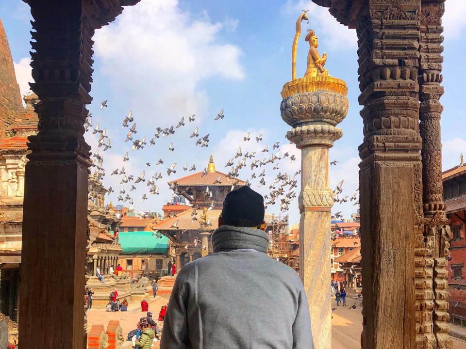 a man overlooking patan durbar in nepal.