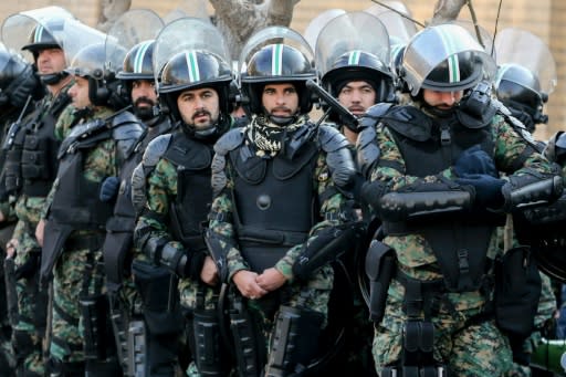 Iranian security forces in front of the British embassy in the capital Tehran during demonstrations following the British ambassador's arrest for allegedly attending an illegal demonstration