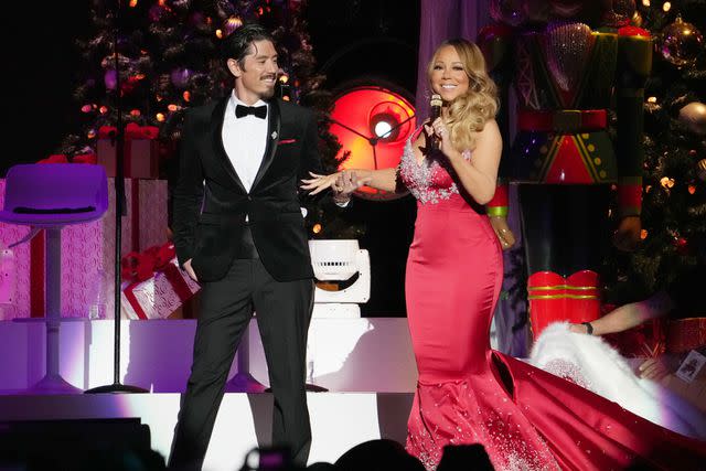 <p>Kevin Mazur/Getty</p> Bryan Tanaka and Mariah Carey