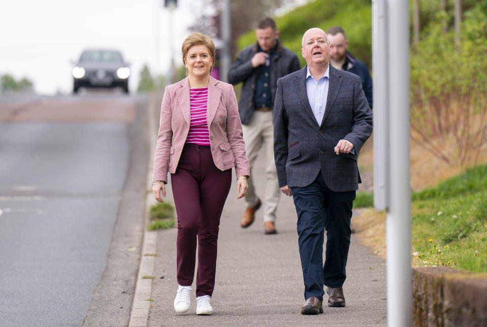 Sturgeon pictured with her husband Peter Murrell, during local government elections in Scotland last May. (Getty)