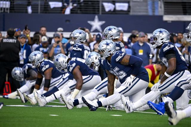 Cowboys look to break curse, record first playoff win in navy jerseys