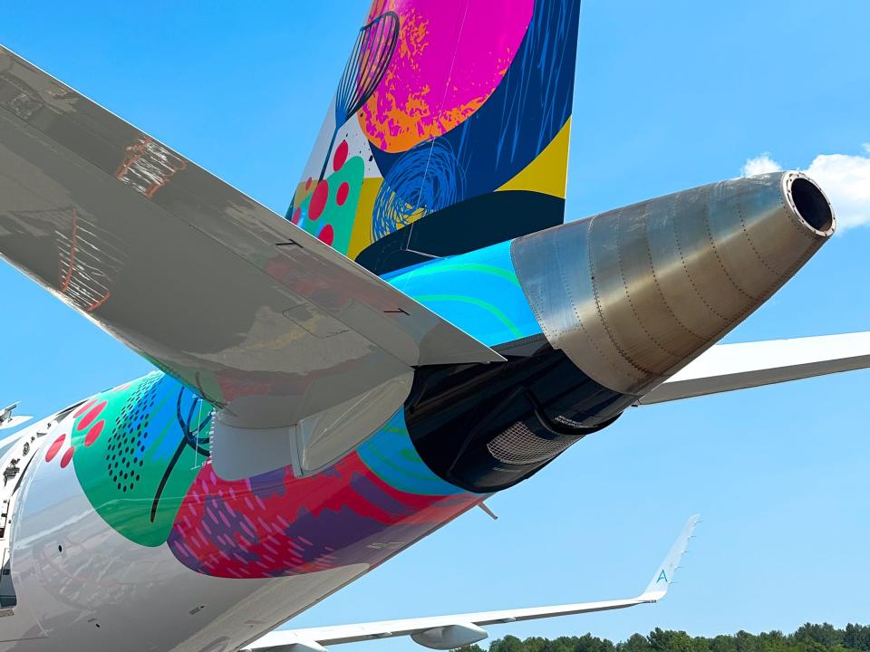 The colorful livery on the tail of the BermudAir E175.