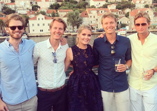 Lady Kitty Spencer poses with her younger brother Louis far left on holidays.