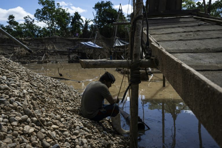 As the international price of gold soared in recent years to reach an all-time high in May, appetite for the precious metal has only increased in Peru -- the world's tenth biggest producer and second in Latin America (Ernesto BENAVIDES)