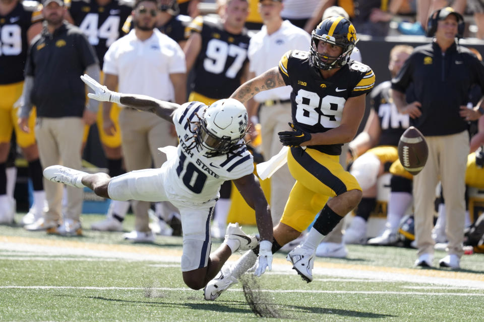 Utah State cornerback Jaiden Francois (10) breaks up a pass intended for Iowa wide receiver Nico Ragaini (89) during the second half of an NCAA college football game, Saturday, Sept. 2, 2023, in Iowa City, Iowa. Iowa won 24-14. (AP Photo/Charlie Neibergall)