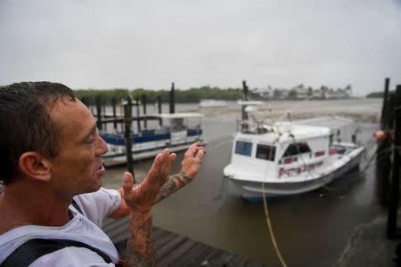 Local fisherman P.J. Pike explains the danger his boat will face during a 15 foot storm surge in Hurricane Harbor, as hurricane Irma approaces Fort Myers Beach, Florida, U.S., September 10, 2017. REUTERS/Bryan Woolston