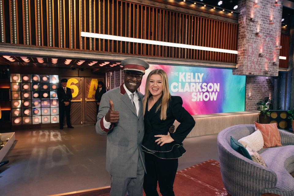 Kelly Clarkson, right, poses with "Mayor of Rockefeller Center" Correll Jones, aka CJ.