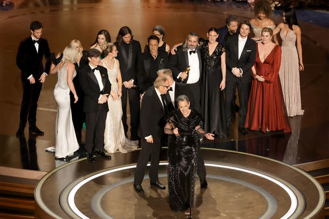 <p>Kevin Winter/Getty Images</p> Cast and crew accept the Best Picture award for 'Oppenheimer' onstage during the 96th Annual Academy Awards