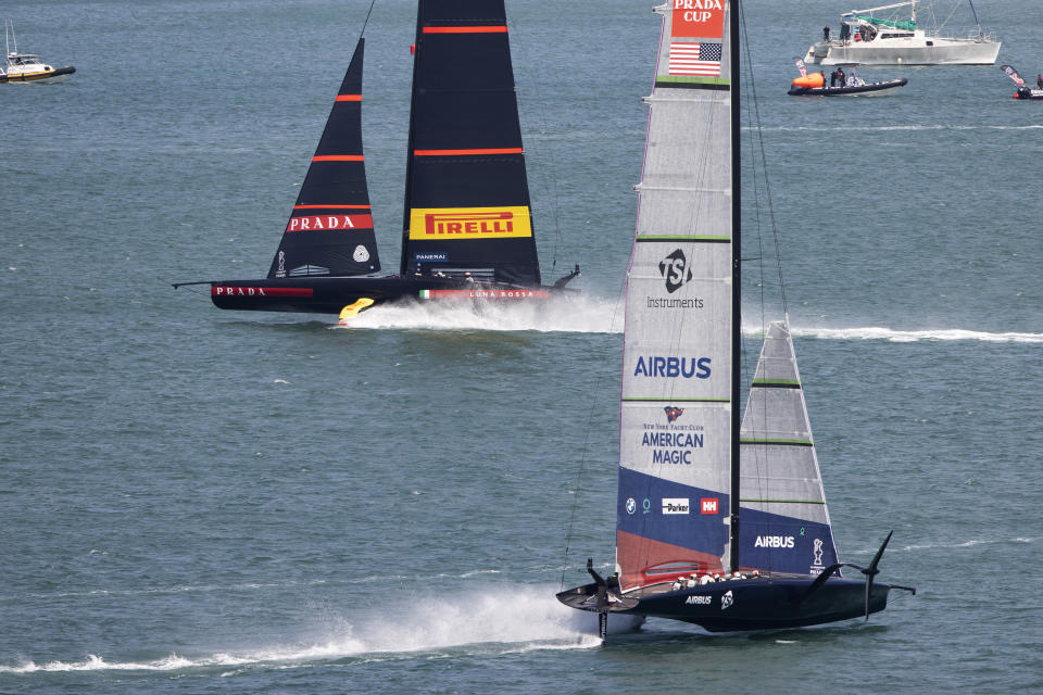 FILE - In this Jan. 29, 2021, file photo, Italy's Luna Rossa, left, leads American Magic during the America's Cup challenger series on Auckland's Waitemate Harbour, New Zealand. The sting of being the first team eliminated from the 36th America's Cup is going to be with the New York Yacht Club's American Magic for quite some time. American Magic has had a week to ponder the end of its campaign, which was hastened when its yacht, Patriot, capsized and nearly sank during a race in the challenger round-robins on Jan. 17 during a race against Italy's Luna Rose Prada Pirelli Team. (Brett Phibbs/NZ Herald via AP, File)