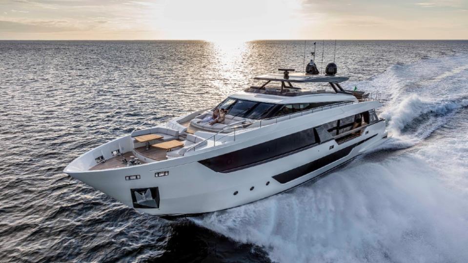 There are defining moments in every brand, and for the Ferretti Group, that came last week with the launch of the Ferretti Yachts 1000. The Italian builder’s new flagship is not only the largest boat it has ever built, but its design is part of a new revolution taking place in the 90- to 110-foot motoryacht segment. Its main competitors, Azimut and Princess, have recently launched models in the range, and both share the Ferretti’s “wide-body” approach, which essentially means packing a third more interior volume into the same length of hull. The Azimut Trideck and Princess X95 are both successful designs, though the profiles are more radical-looking than the Ferretti 1000, which has a more traditional look. Stefano de Vivo, Ferretti Group’s chief commercial officer told Robb Report during a tour of the 1000 that it was a “crucial” new design. “It will be a template for other models going forward,” he said. “At the same time, the 1000 is not an urban apartment on the water. It’s modern and minimalist, but definitely marine.” The design team, including Ferretti’s Filippo Salvetti, who penned the exterior and IdeaeItalia, which created the interior, focused on presenting the brand’s yachting heritage. “We may have gone a little far with earlier models,” says De Vivo, referring to the residential look of other yachts in the line. While larger interior volumes are in high demand with new boaters, there are challenges. The first is keeping the profile from looking bloated. Salvetti did a good job with that by creating a top deck that looks slender, along with a larger hull body defined by racy, angular dark windows that give the impression of performance. The second is actually divvying up the unusually large interior volume so it’s proportional to its actual function within the yacht. That extra-large salon might seem like a big benefit, but if it seems like a vast empty space that sacrifices galley size, for instance, then the boat doesn’t function properly. I didn’t see any evidence of that on the 1000 which has, what the company calls its “new flow concept,” so that individual rooms feel large and spacious and there is a natural movement through the boat uninhibited by unnecessary bulkheads or cramped rooms. The main salon is big, but the design team used floor-to-ceiling windows on the sides and rear, furnishing it elegantly but sparingly. Walnut’s the prevailing wood across the interior, with the designers using subtle, striped patterns for the walls and bold, flame-colored hues for dining table and other furniture. Accents have a special ribbed pattern. There’s a traditional, almost classic coordination of the colors and materials, as opposed to the 1000’s competitors, a bit louder and more experimental in design. “Owners can customize the interiors if they want another look,” Celine Binard, part of the Ferretti design team, said during a tour. The 1000 took three years from the initial drawings to the first hull, tkkkk, which was going to a French owner, who made minimal changes to the classic styling. What struck me most about the 1000 was the level of detail that went into making it work in a simple, straightforward way. Looking through the full-height windows in the main salon, the designers had cut away a portion of the side passage so that instead of seeing the outer wall, it was a clear view of the water. That involved some serious structural engineering to enhance the owner’s view. It also had features like a Garvan audio system, which include hidden speakers embedded into the ceiling for a clearer, more uniform sound, while preserving the minimalist impression of the interior. That was apparent all over the boat, from the 110-square foot galley, which is much larger than on most boats this size, to the spacious main suite forward, with a full-beam ensuite, picture windows on either side of the bed and chair and table that could serve as an office. The cockpit behind the main suite was also conceived to be a comfortable space that is protective but offers clear views of the water. Ditto the lounges, table and sunbeds on the foredeck, which turn what is typically the working end of the yacht into a private social area. My favorite space was the upper deck, with carbon-fiber hardtop with slats forward that offers both sun protection and more sunlight, depending on owner preference; then there’s an al-fresco dining table on port and a large wetbar/outdoor kitchen to the right. At the rear are lounges for socializing. The 600-sq. ft. space is often a nook on similari-sized yachts, but Ferretti (and its competitors) realize how many people prefer comfortable outdoor living, so have made it a main feature. Binard says everything on the 1000 was “measured in millimeters,” which explains why deck sizes and the features within feel big but livable. “Structurally, it was a challenging design because of its size,” she adds. “The engineering was very different than our smaller yachts.” Tkkk has four guest staterooms on the lower deck, and a large beach area at the transom. The beach, combined with the terrace just above, measures a whopping 440 square feet—equivalent to a much larger yacht. What’s also unusual about the 1000 is its 28-knot top speed, thanks to twin 2217-hp MTU diesels. That’s lightning fast for a boat its size. The Ferretti folks declined to say what size model would be coming next, but it’s definitely going to have the look, feel and space of the 1000. Check out more images of the new flagship. 