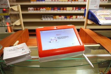 A Nickel bank account machine is presented in a simulated tobacconist shop at a news conference in Paris October 16, 2013. REUTERS/Benoit Tessier