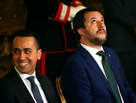 FILE PHOTO: Interior Minister Matteo Salvini looks on next to Italy's Minister of Labour and Industry Luigi Di Maio at the Quirinal palace in Rome, Italy, June 1, 2018. REUTERS/Tony Gentile/File Photo
