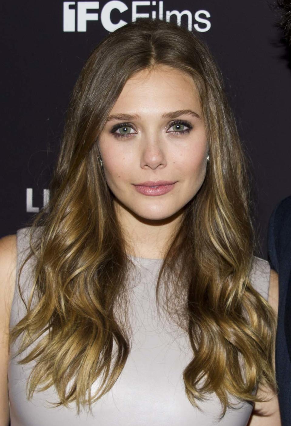 FILE - This Sept. 10, 2012 photo shows Elizabeth Olsen at the "Liberal Arts" premiere in New York. Olsen will soon be a star-crossed lover _ she'll star in an off-Broadway version of Shakespeare's “Romeo & Juliet.” Classic Stage Company said Thursday that the younger sister of Mary-Kate and Ashley Olsen will help will kick off their 2013/2014 season. (Photo by Charles Sykes/Invision/AP, file)