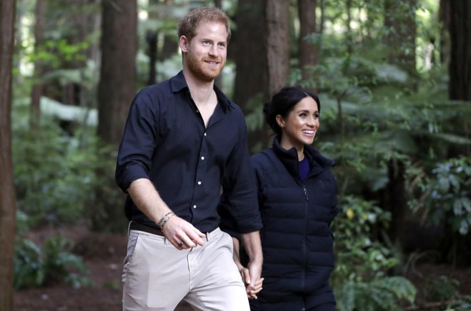 Prince Harry Snaps Photo of Meghan Markle Cradling Baby Bump