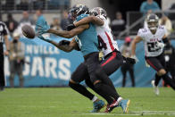 Atlanta Falcons cornerback A.J. Terrell, front right, breaks up a pass intended for Jacksonville Jaguars wide receiver Marvin Jones Jr., left, during the second half of an NFL football game, Sunday, Nov. 28, 2021, in Jacksonville, Fla. (AP Photo/Phelan M. Ebenhack)