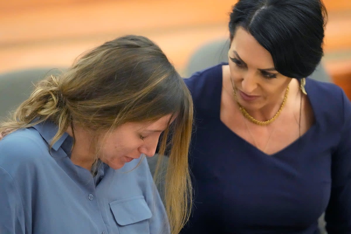 Kouri Richins is comforted by her attorney Skye Lazaro during a status hearing on Friday in Utah (AP)