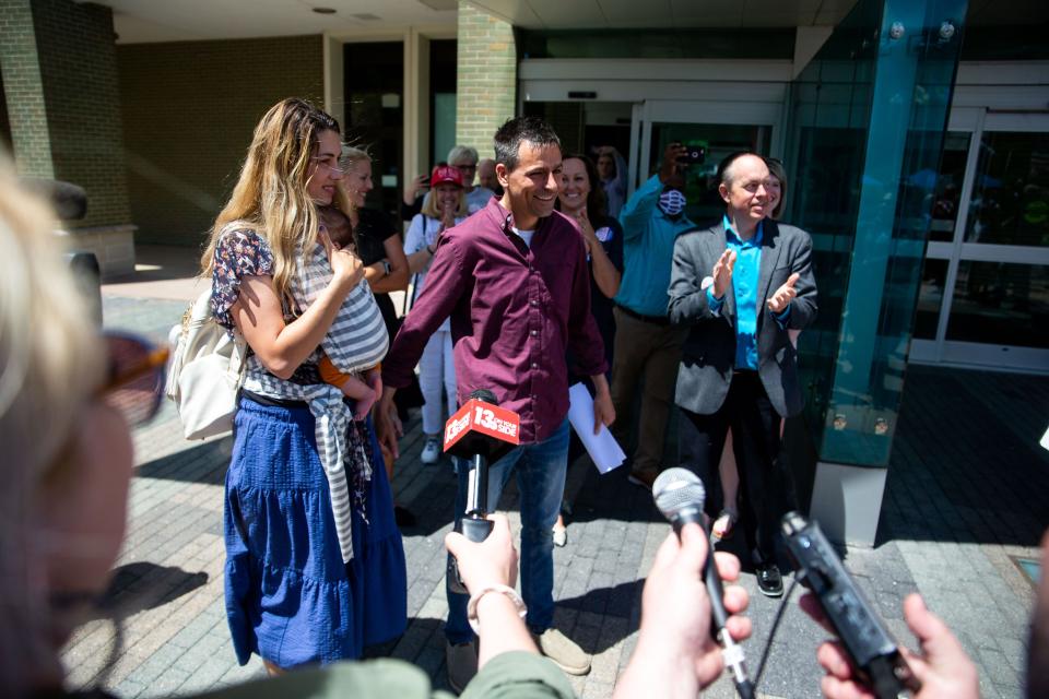 Former GOP gubernatorial candidate Ryan Kelley exits the courthouse with his wife after his arraignment on Thursday, June 9, 2022, at the Gerald R. Ford Federal Building.