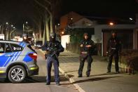 Police officers are seen after a shooting in Hanau near Frankfurt