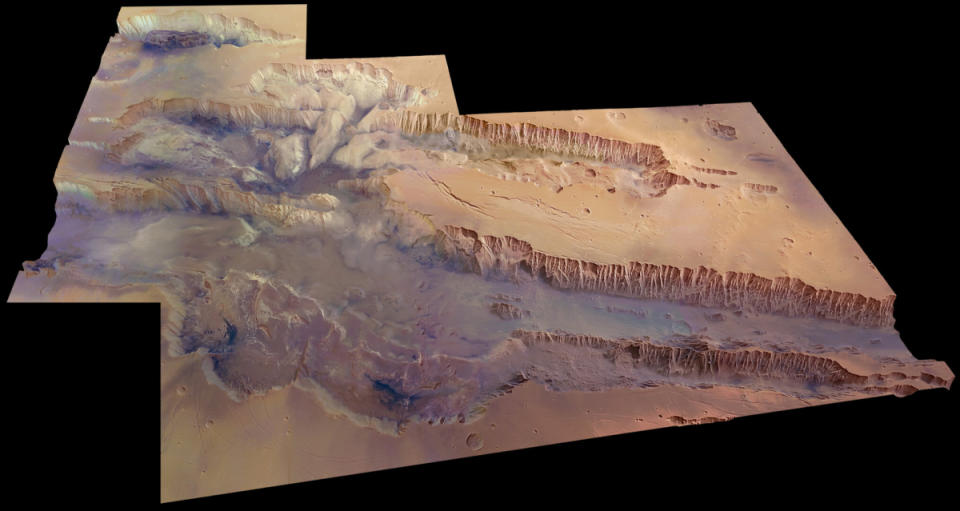 Map of reddish brown terrain on Mars.  A large canyon stretches from left to right in the middle of the image