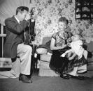 <p>Desi Arnaz photographs his wife Lucille Ball and their newborn son, Desi Arnaz Jr. at their home in California in 1953. </p>