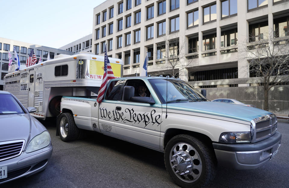 A vehicle carrying Otero County, New Mexico Commissioner Couy Griffin, arrives outside the Federal Court House in Washington, Monday, March. 21, 2022. Griffin is charged with illegally entering Capitol grounds the day a pro-Trump mob disrupted certification of Joe Biden's presidential election victory on Jan. 6, 2021. (AP Photo/Gemunu Amarasinghe)