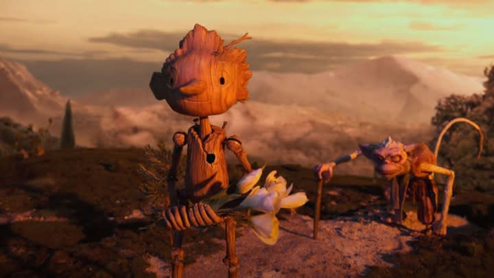 Pinocchio holding flowers in Guillermo del Toro's Pinocchio.