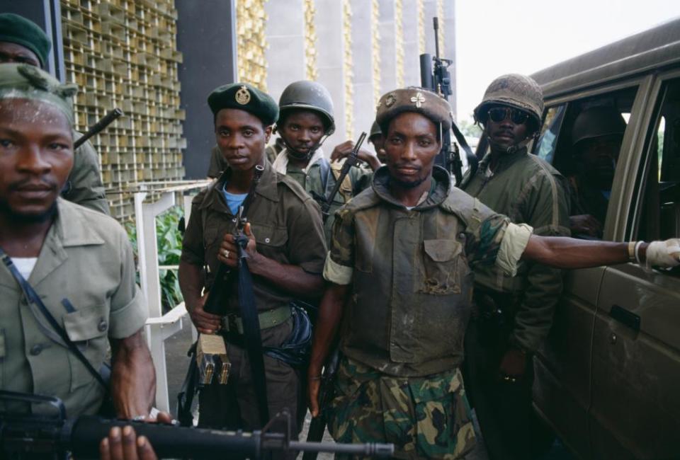 Colonel Michael Tilly, right, leader of the “Death Squad,” a faction of President Samuel Doe’s Armed Forces of Liberia, with his troops in Monrovia.