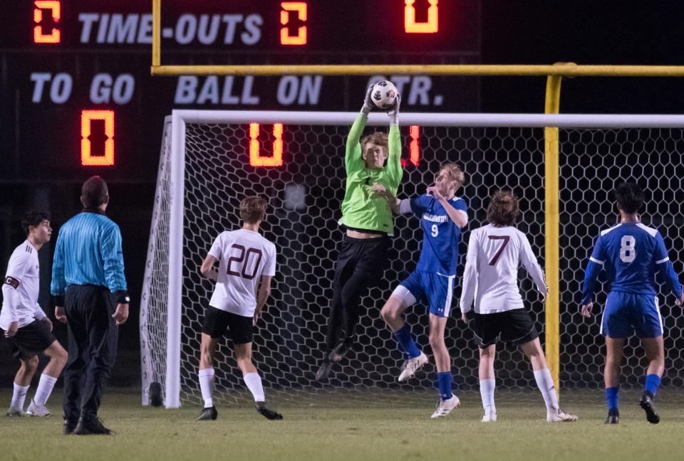 Aggies goalkeeper Zac Clary makes a save during the Tate vs Washington boys soccer game at Booker T. Washington High School in Pensacola on Thursday, Jan. 13, 2022.