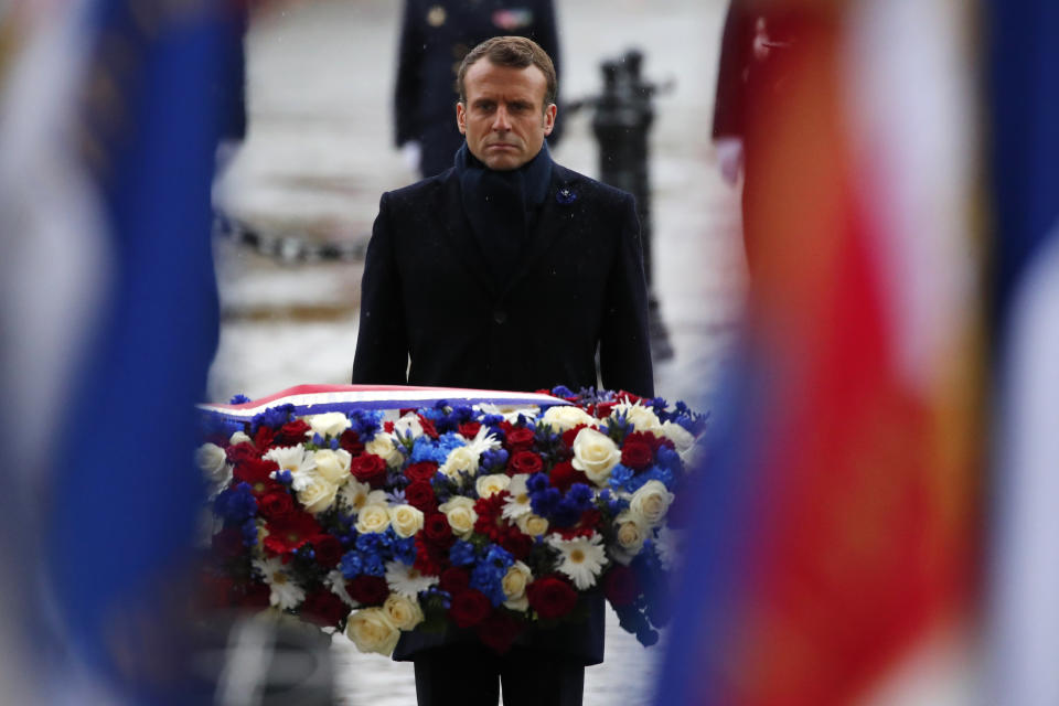 French President Emmanuel Macron lays a wreath of flowers at the Arc de Triomphe in Paris Monday Nov. 11, 2019 during commemorations marking the 101st anniversary of the 1918 armistice, ending World War I. (AP Photo/Francois Mori, Pool)