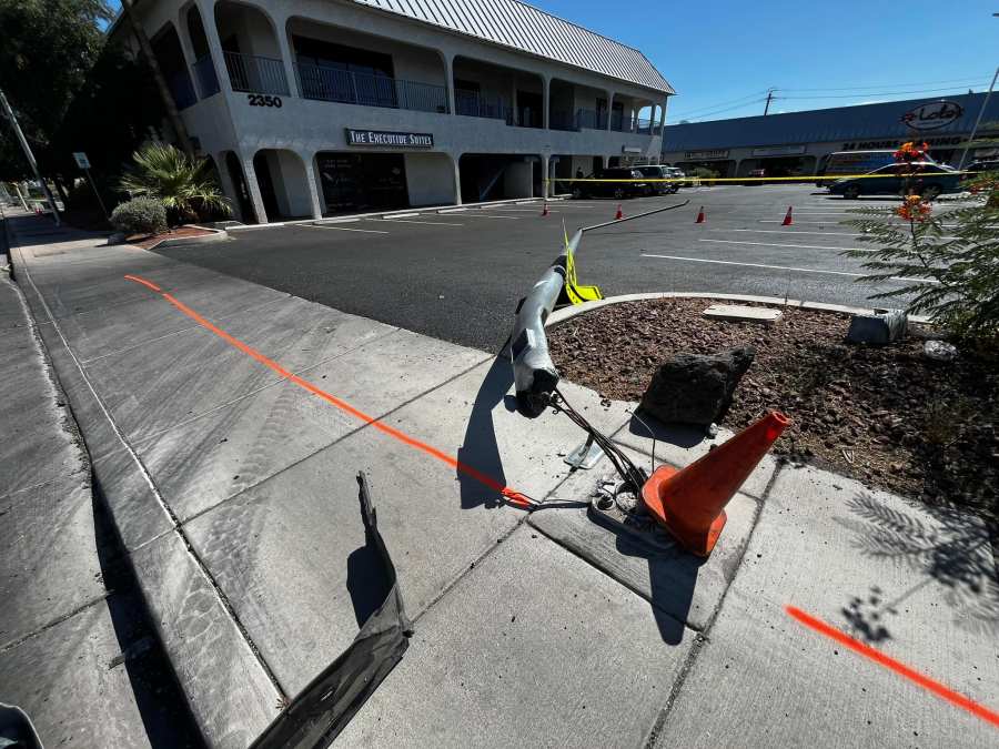 A light pole knocked down by a car that crashed during a street race on Jones Boulevard, north of Sahara Avenue.  (Las Vegas Metropolitan Police Department)