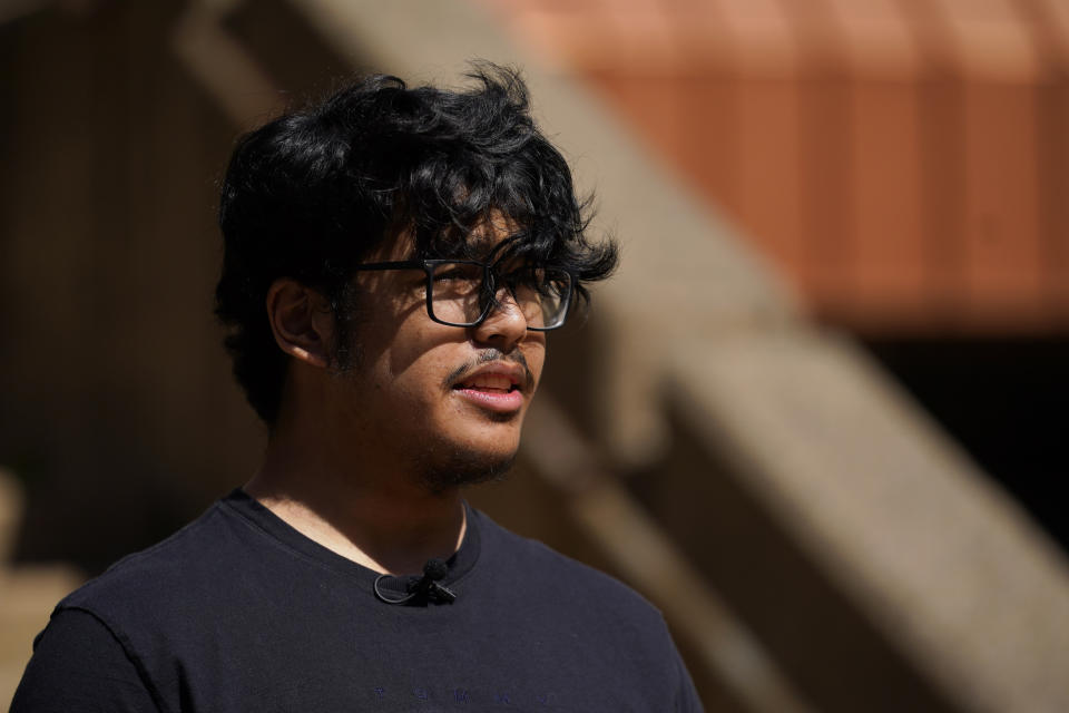 Upper Darby High School student Khalid Doulat, 18, speaks with a reporter during an interview in the campus courtyard, Wednesday, April 12, 2023, in Drexel Hill, Pa. For some schools, the pandemic allowed experimentation to try new schedules. Large school systems including Denver, Philadelphia and Anchorage, Alaska, have been looking into later start times.(AP Photo/Matt Slocum)