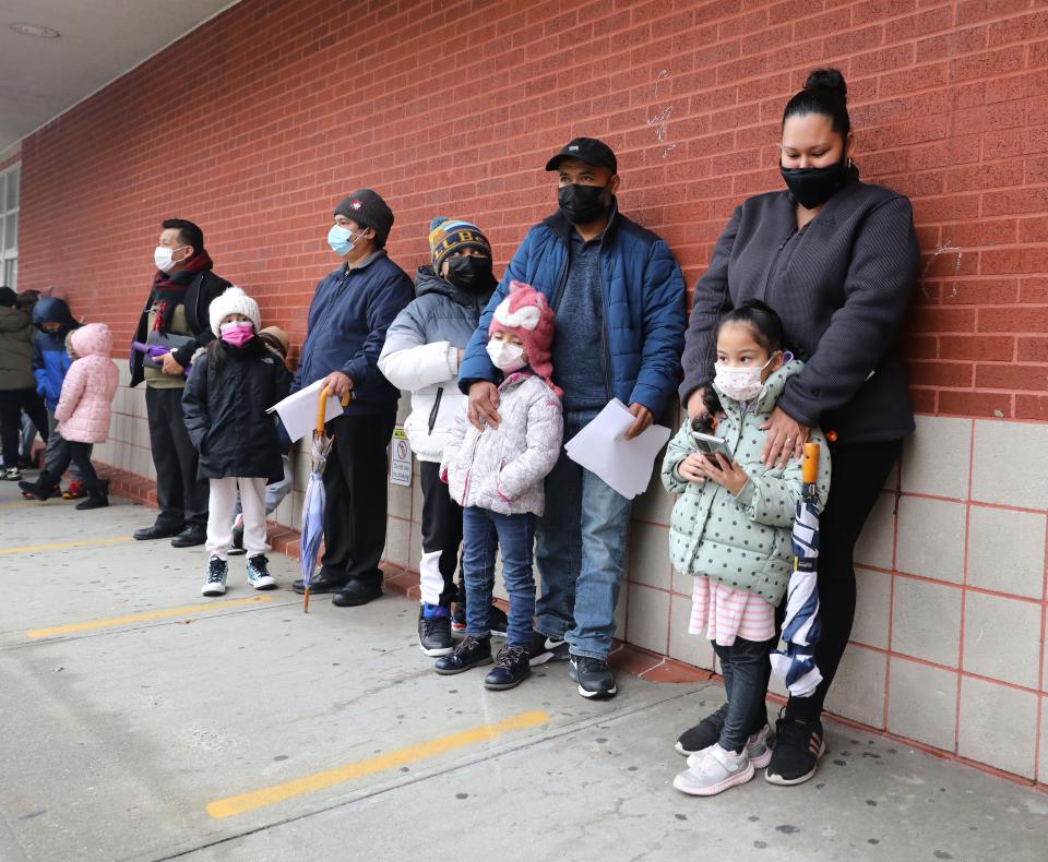 Students, parents and staff wait for COVID tests at the Eugenio Maria de Hostos MicroSociety School in Yonkers in December 2021.