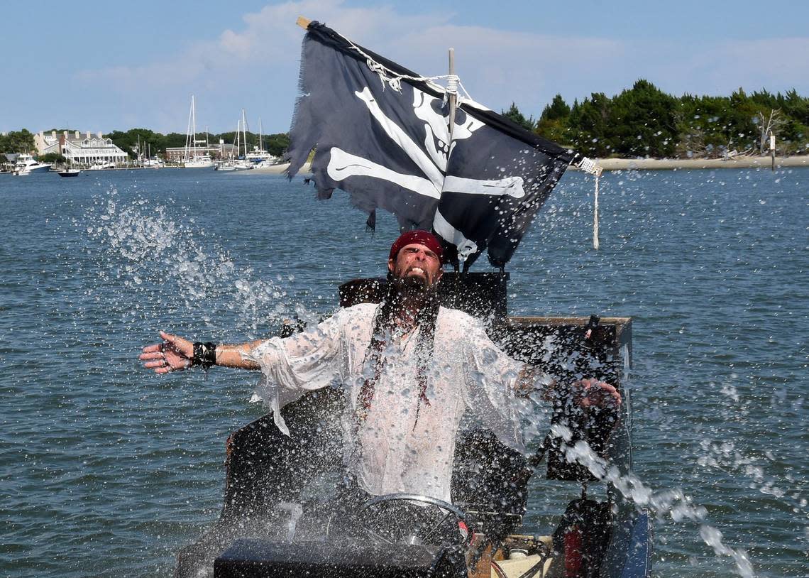 Pirate Kegger Finney is doused by the crew of the “Revenge” by water canons during the Pirate Treasure Cruise aboard the “Revenge” in Beaufort, N.C. in 2016.