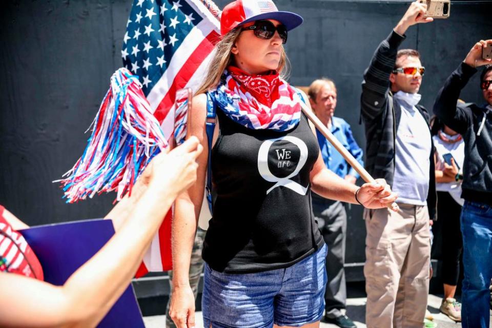 QAnon demonstrators protest during a rally to reopen California in San Diego on 1 May.