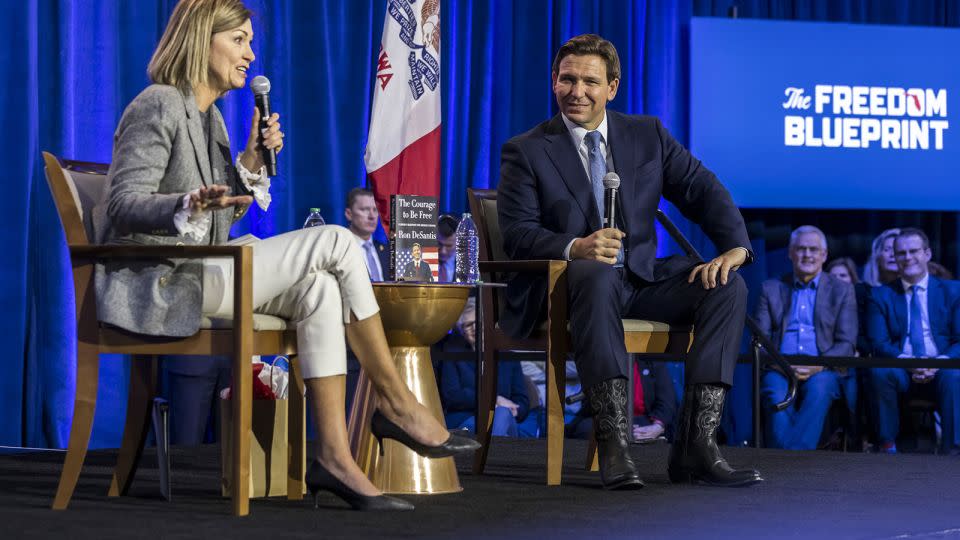 Reynolds and Florida Gov. Ron DeSantis are seen during an event in Des Moines on March 10, 2023.  - Kathryn Gamble/BloombergGetty Images/FILE