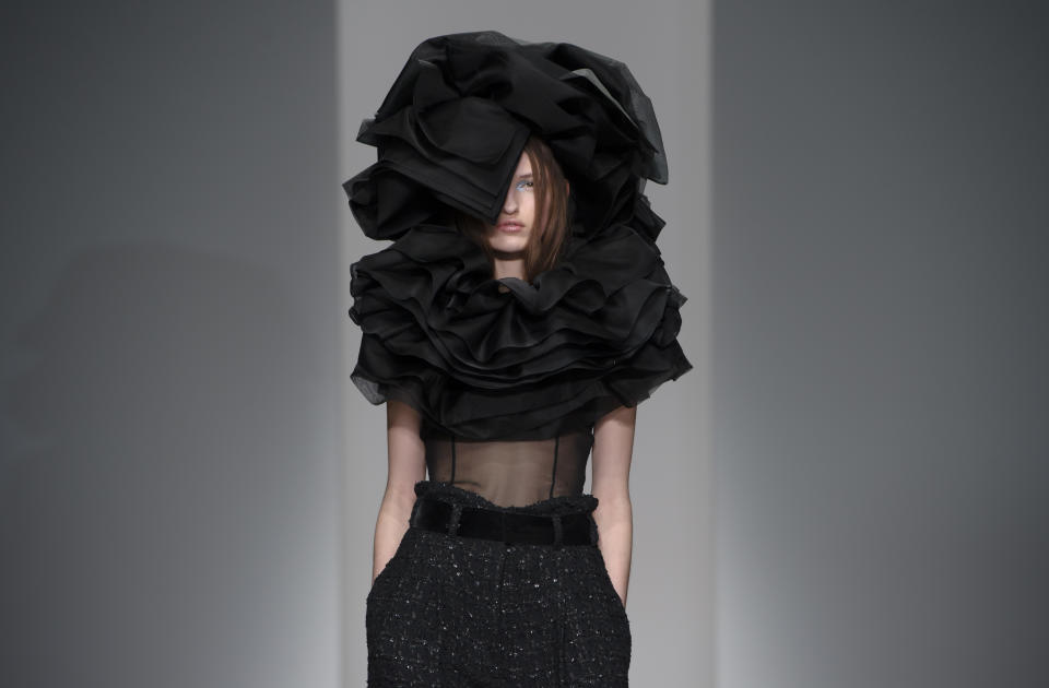 A model wears a design created by John Rocha during London Fashion Week Autumn/Winter 2014, at Somerset House in central London, Saturday, Feb. 15, 2014. (Photo by Jonathan Short/Invision/AP)