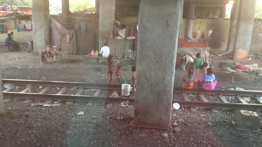 The original photo taken by Dick Smith. The girl he was searching for is standing near the train tracks wearing nothing but a pink bracelet on her wrist. Photo: Facebook