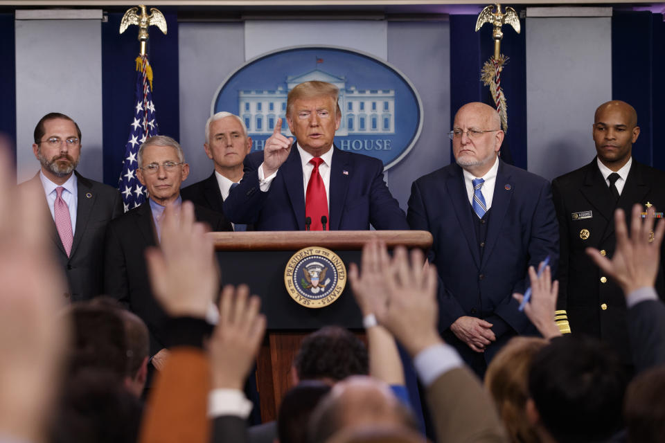 FILE - In this Feb. 29, 2020, file photo President Donald Trump, center, points as he prepares to answer question after speaking about the coronavirus in the press briefing room at the White House in Washington, as Health and Human Services Secretary Alex Azar, National Institute for Allergy and Infectious Diseases Director Dr. Anthony Fauci, Vice President Mike Pence, Robert Redfield, director of the Centers for Disease Control and Prevention and U.S. Surgeon General Dr. Jerome Adams listen. Public health officials were already warning Americans about the need to prepare for the coronavirus threat in early February when President Donald Trump called it “deadly stuff” in a private conversation that has only now has come to light. (AP Photo/Carolyn Kaster, File)