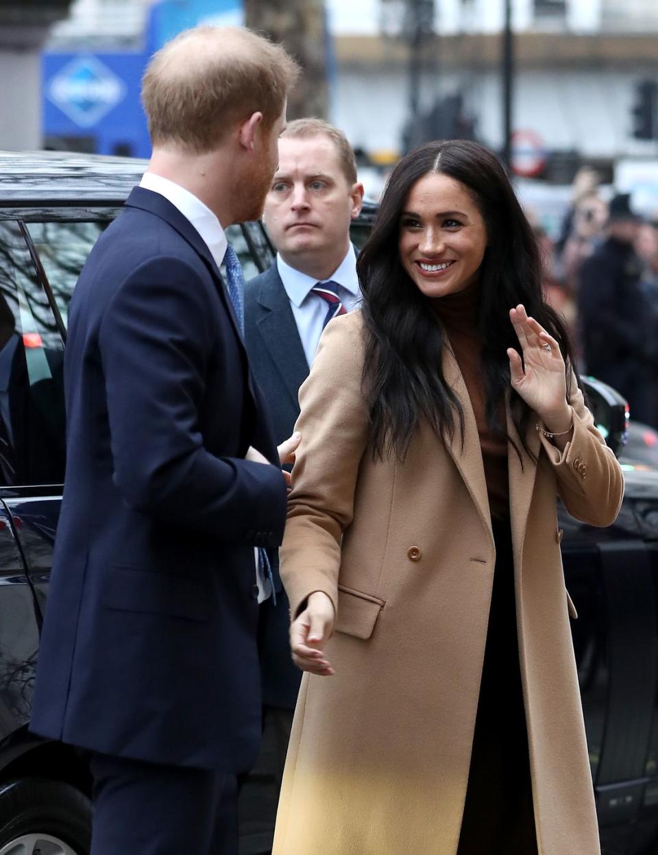 <p>Meghan was spotted wearing this camel coat alongside her boo (also known as the Duke of Sussex) while arriving at Canada House in London. Also, those waves! Please give us your secret, Megs. </p>