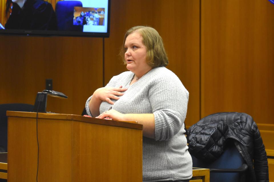 Adrian resident Brigitte Sneyd speaks to Lenawee County Probate Court Judge Catherine A. Sala on Monday during Lenawee County's observance of Adoption Day. Sneyd, along with her husband, Dennis, were granted approval to adopt Dennis' two younger brothers Brantly, 10, and Seth, 8.