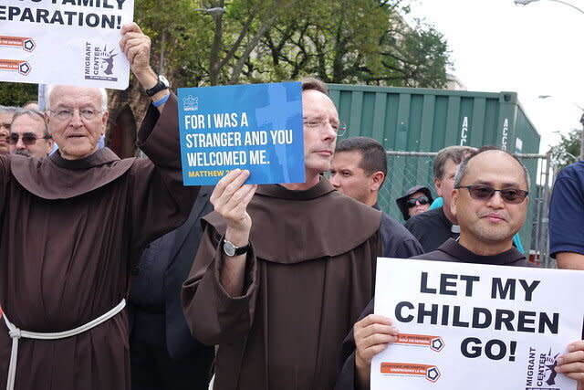 Protesters hold signs during a demonstration in Newark against the U.S. government's detention of migrant families and children. (Photo: Ignatian Solidarity Network)