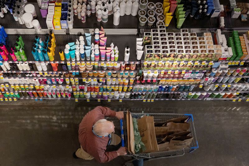 FILE PHOTO: A person pushes a shopping cart in a supermarket in Manhattan, New York City