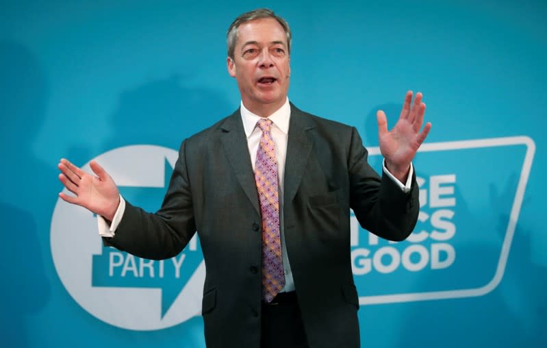 FILE PHOTO: Brexit Party leader Nigel Farage speaks during a visit at a boxing gym in Ilford