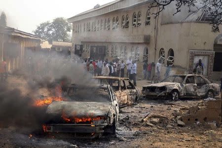 A car burns at the scene of a Christmas Day bomb explosion that the Islamist militant group Boko Haram claimed responsibility for at St. Theresa Catholic Church at Madalla, Suleja, just outside Nigeria's capital Abuja in this file photo taken December 25, 2011. REUTERS/Afolabi Sotunde/Files