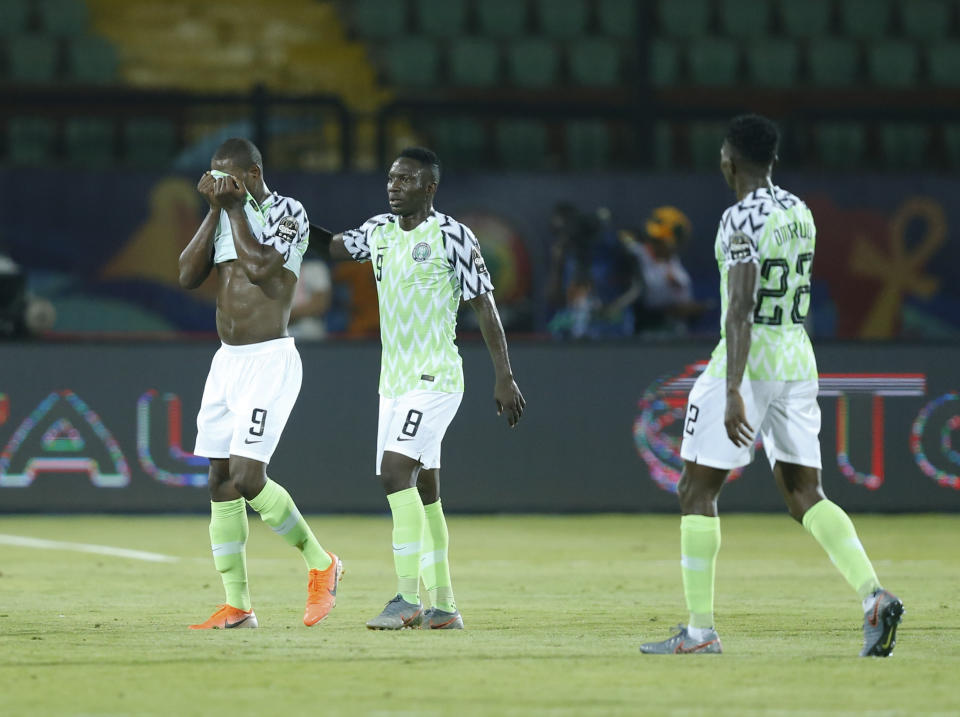 Nigeria's Odin Ighalo, left, leaves the pitch because of an injury during the African Cup of Nations third place soccer match between Tunisia and Nigeria in Al Salam stadium in Cairo, Egypt, Wednesday, July 17, 2019. (AP Photo/Ariel Schalit)