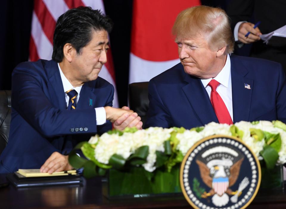 President Donald Trump and Japanese Prime Minister Shinzo Abe shake hands during a meeting on trade in New York, on September 25, 2019, on the sidelines of the United Nations General Assembly. / Credit: SAUL LOEB/AFP via Getty Images